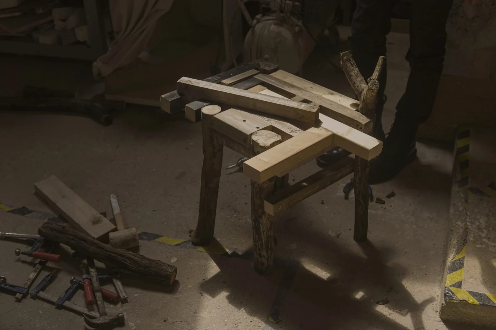 Completed chair assembled from reclaimed irregular logs and trunks